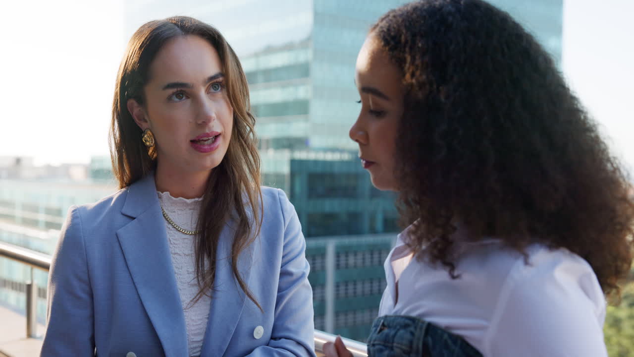 Two businesswomen in outdoor conversation