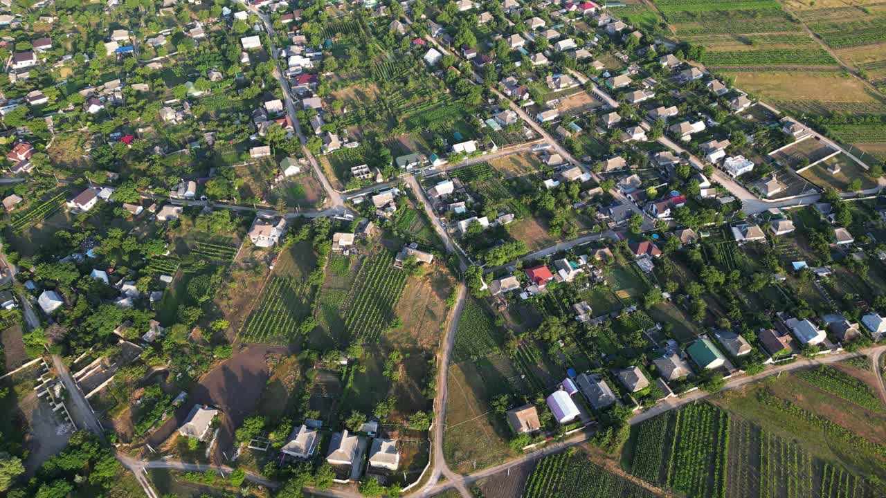 Rural Wanderlust: Captivating Drone Journey through Moldovan Countryside's Farm Fields and Tiny Authentic Molovata Village
