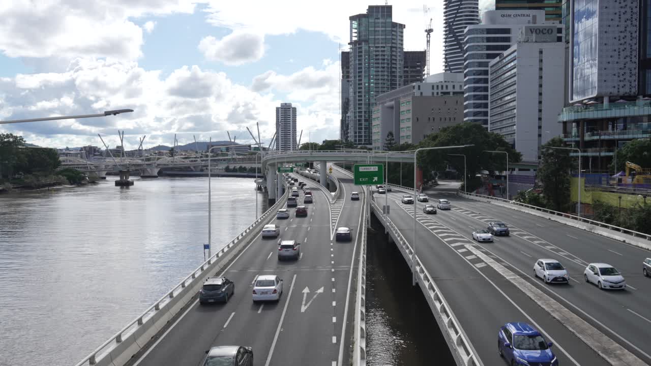 Highway motorway car fluid traffic, Brisbane city buildings view Australia