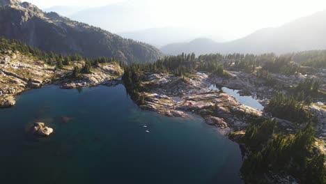 mountaintop paddleboarding on calm lake