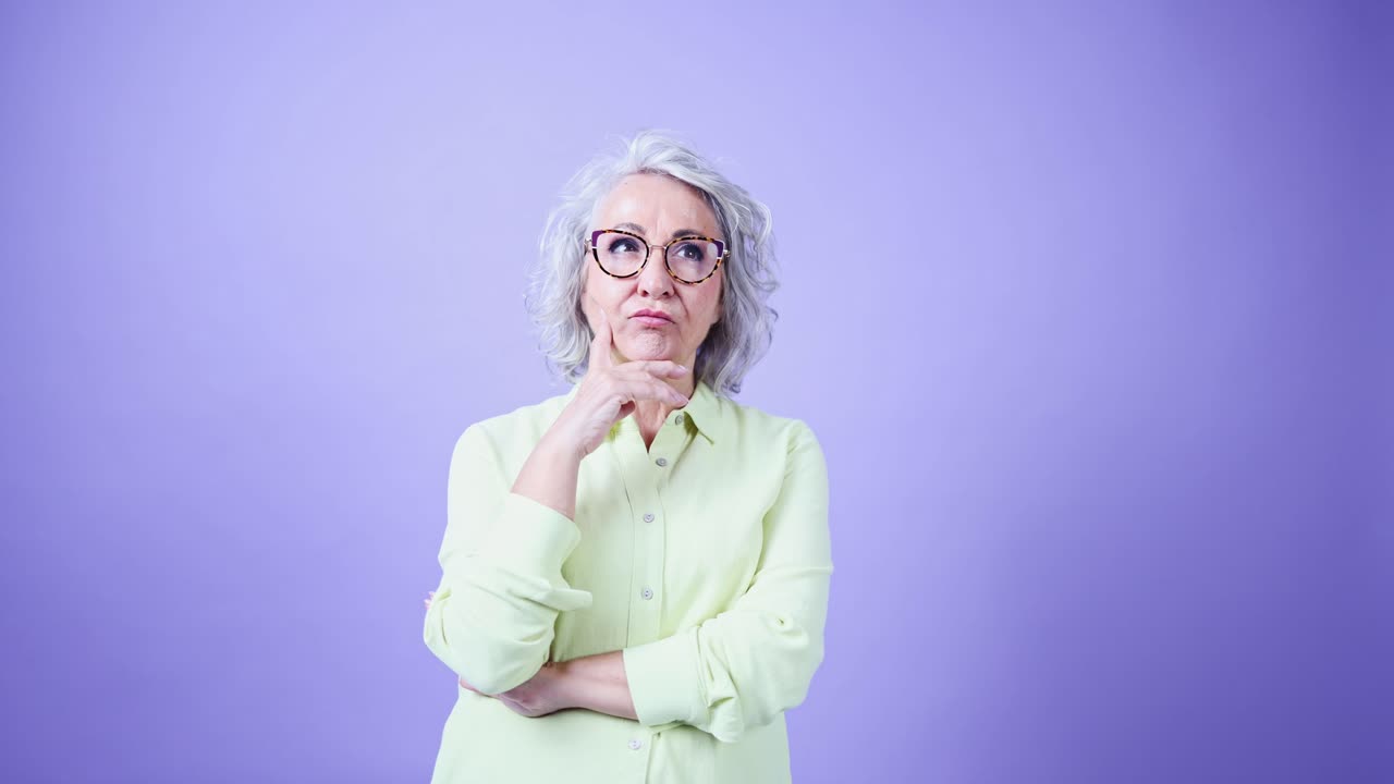 Senior Woman with Gray Hair Thinking and Pondering