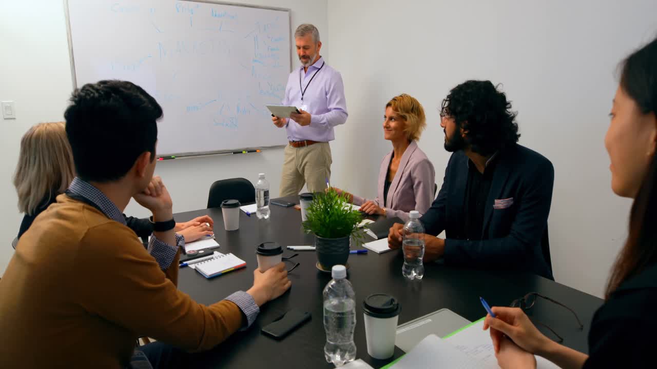 Businessman giving presentation in conference room 4k