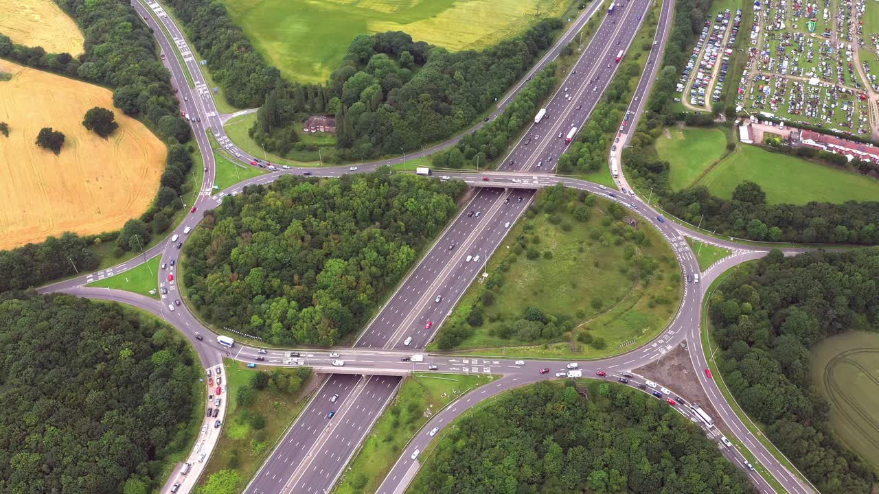 Wide-angle aerial static drone shot of a busy Motorway junction