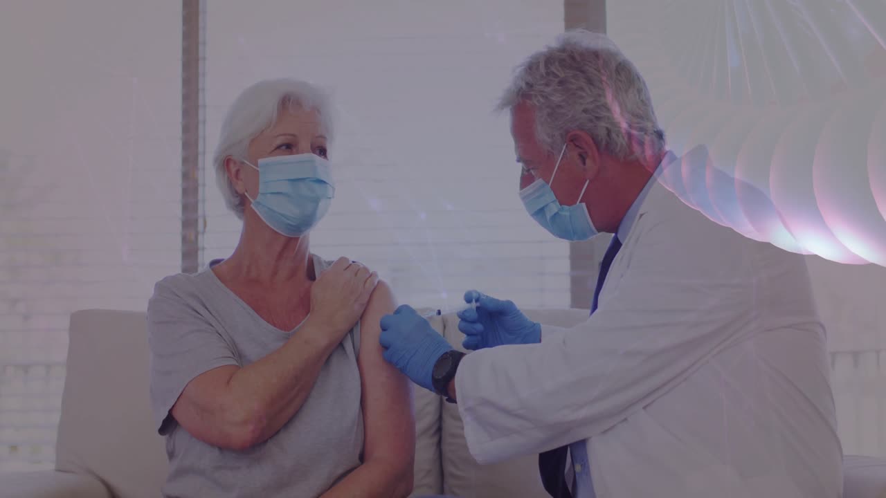 doctor administering vaccine to senior patient on couch showing animated health icons