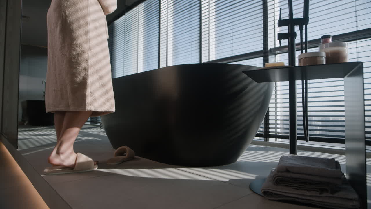 Woman in Bathrobe Getting Ready in Modern Bathroom