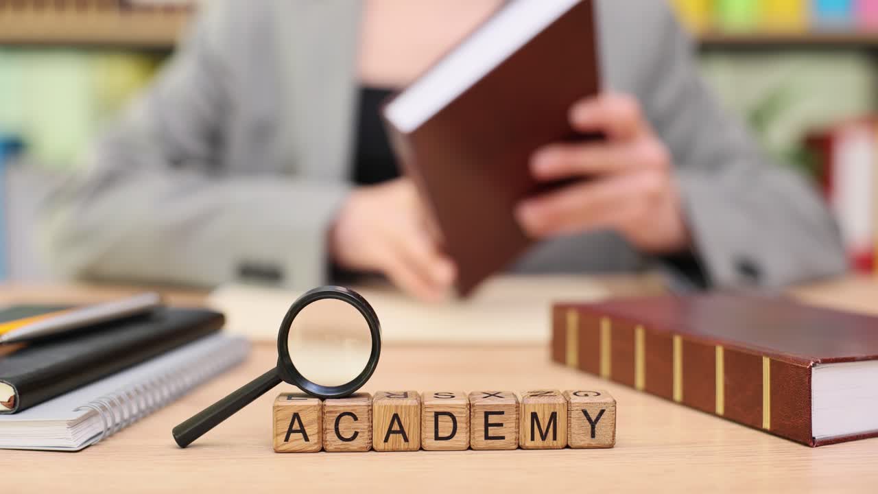 Academy concept with books, magnifying glass, and a person reading