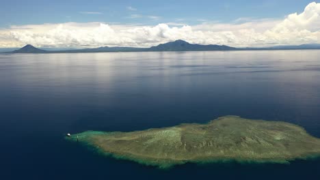 aerial shot of a small island in the middle of the ocean