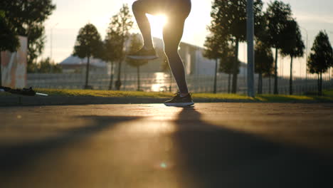 woman exercising outdoors at sunset