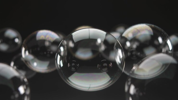 Dolly moving, soap bubbles shifting forward against black, showing main bubble and box highlights
