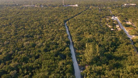 Aerial-view-of-a-road-leading-to-a-resort-in-Playa-Paraiso,-Mexico