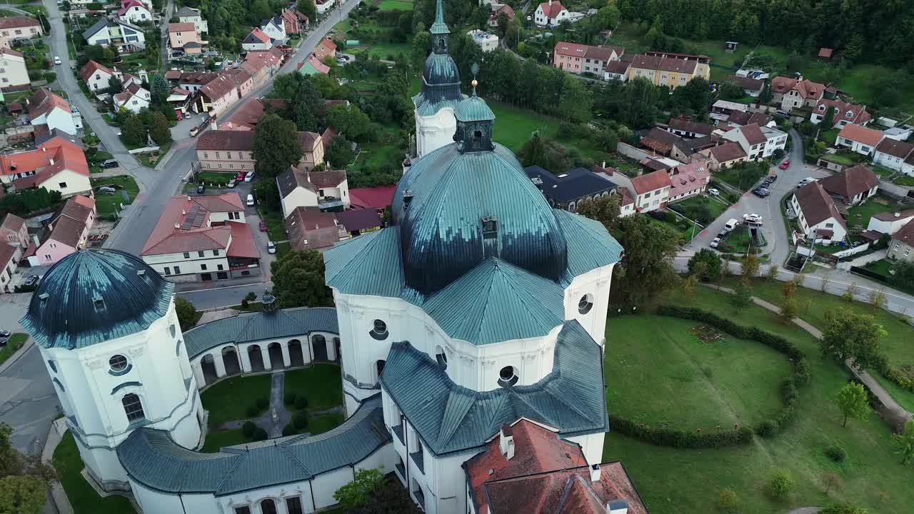 Aerial approaching Křtiny church clock tower