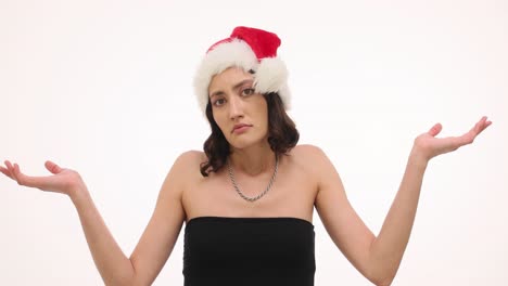 Woman in Santa hat shrugging