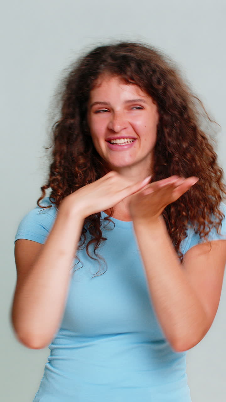 Woman smiling showing money gesture throwing cash dollars funny meme financial success rich mood