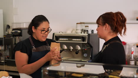 Waitresses-talking-at-workplace