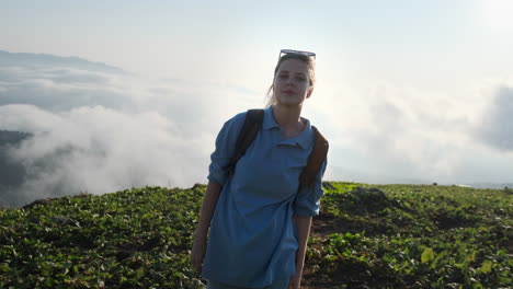 woman hiking in a misty mountain landscape