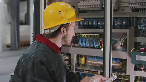 electrician installing electric panel