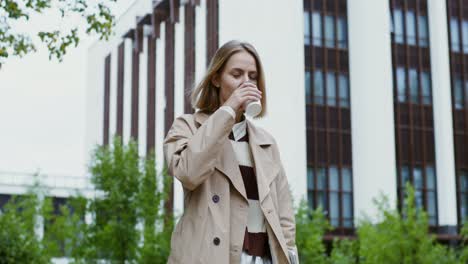 woman drinking coffee outdoors