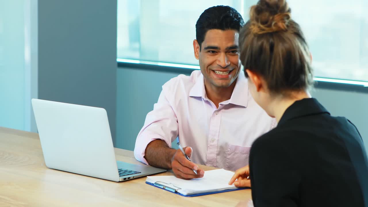 Premium stock video - Recruiter taking interview of female candidate