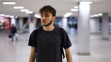 Nervous-man-walking-through-train-station,-lost-in-Budapest