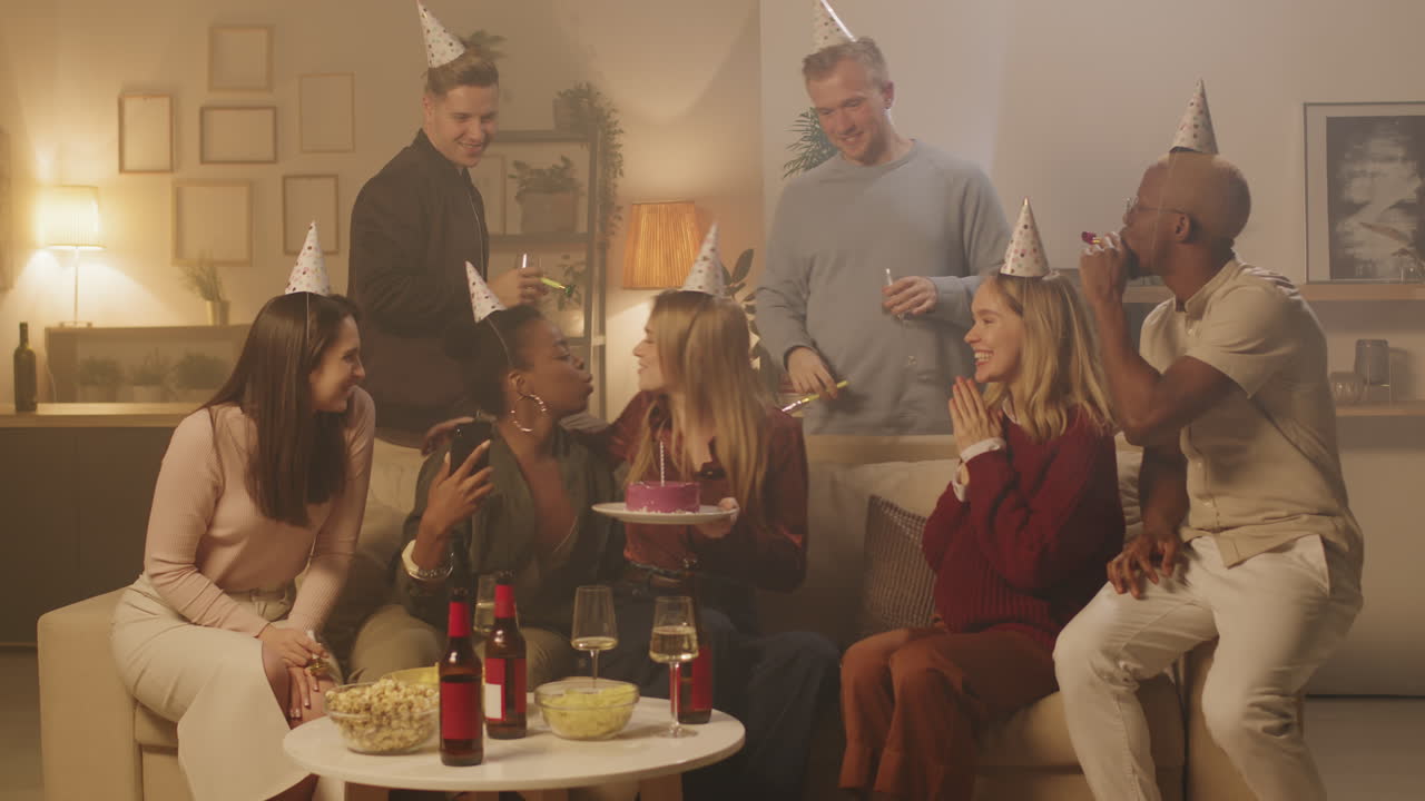 Group of Friends Celebrating Birthday of Young Woman