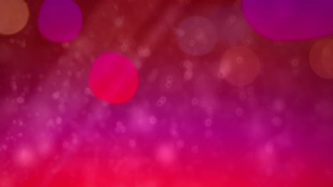 animation of glowing light spots moving over pink background