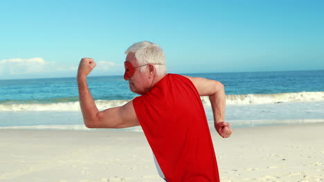 senior man pretending to be superhero