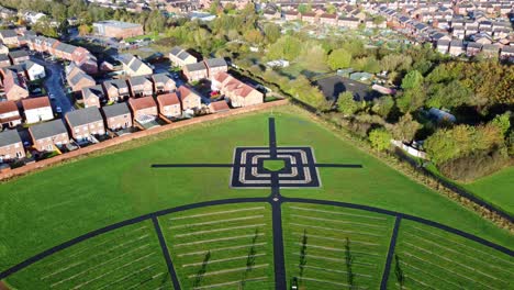 Modern-square-target-cemetery-pathway-design-aerial-pull-back-view-artistic-garden-of-rest-graveyard