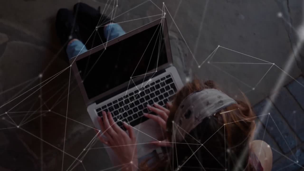 Network of connections against a schoolgirl using laptop