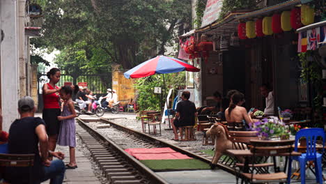 where old hanoi streets meet, there’s a place where trains and homes compete