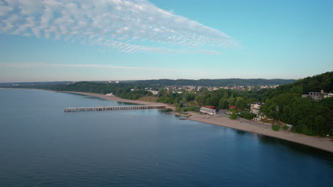 flying a drone towards the shore and the orlowo pier from the bay side from the northeast direction