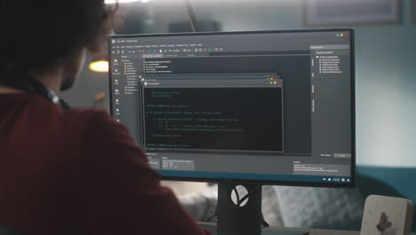 person coding on a computer
