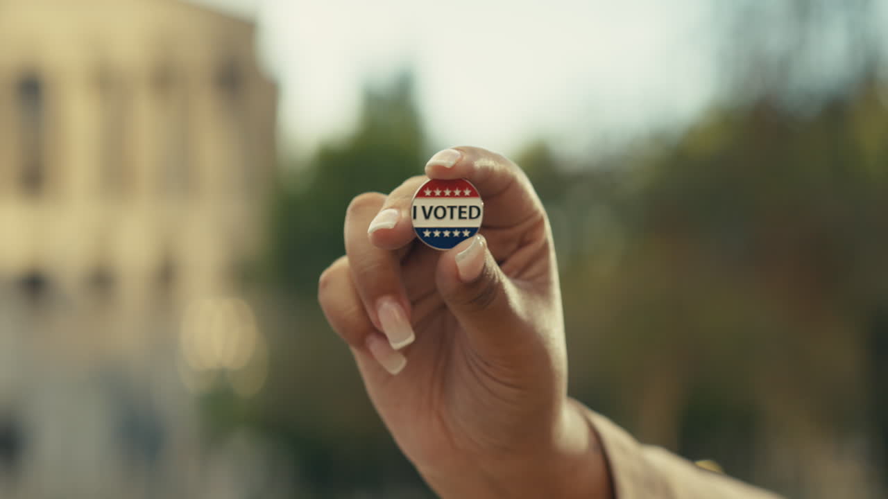 Hand Holding I Voted Sticker