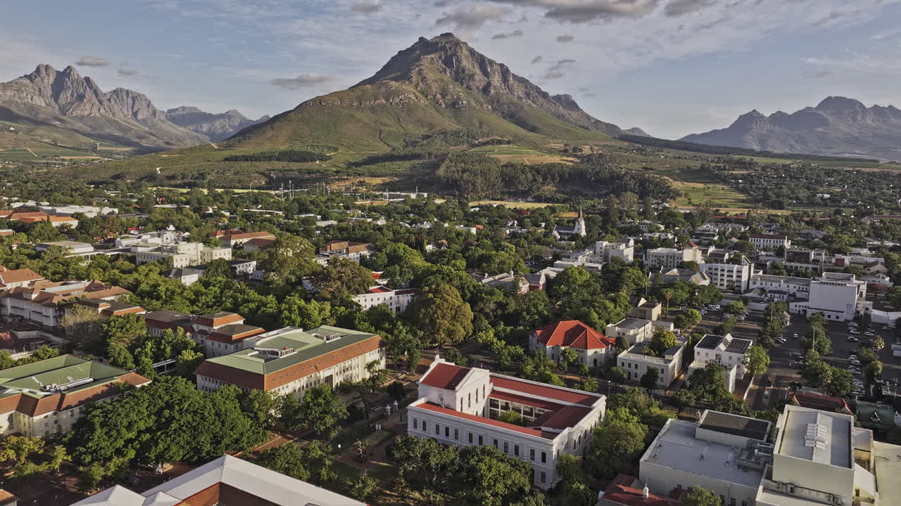 Stellenbosch South Africa Aerial v22 low flyover university campus, capturing a quaint townscape nestled amidst lush greenery and a mountainous landscape - Shot with Mavic 3 Pro Cine - Jan 6th 2024