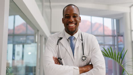 Face,-doctor-and-black-man-smile-with-arms-crossed