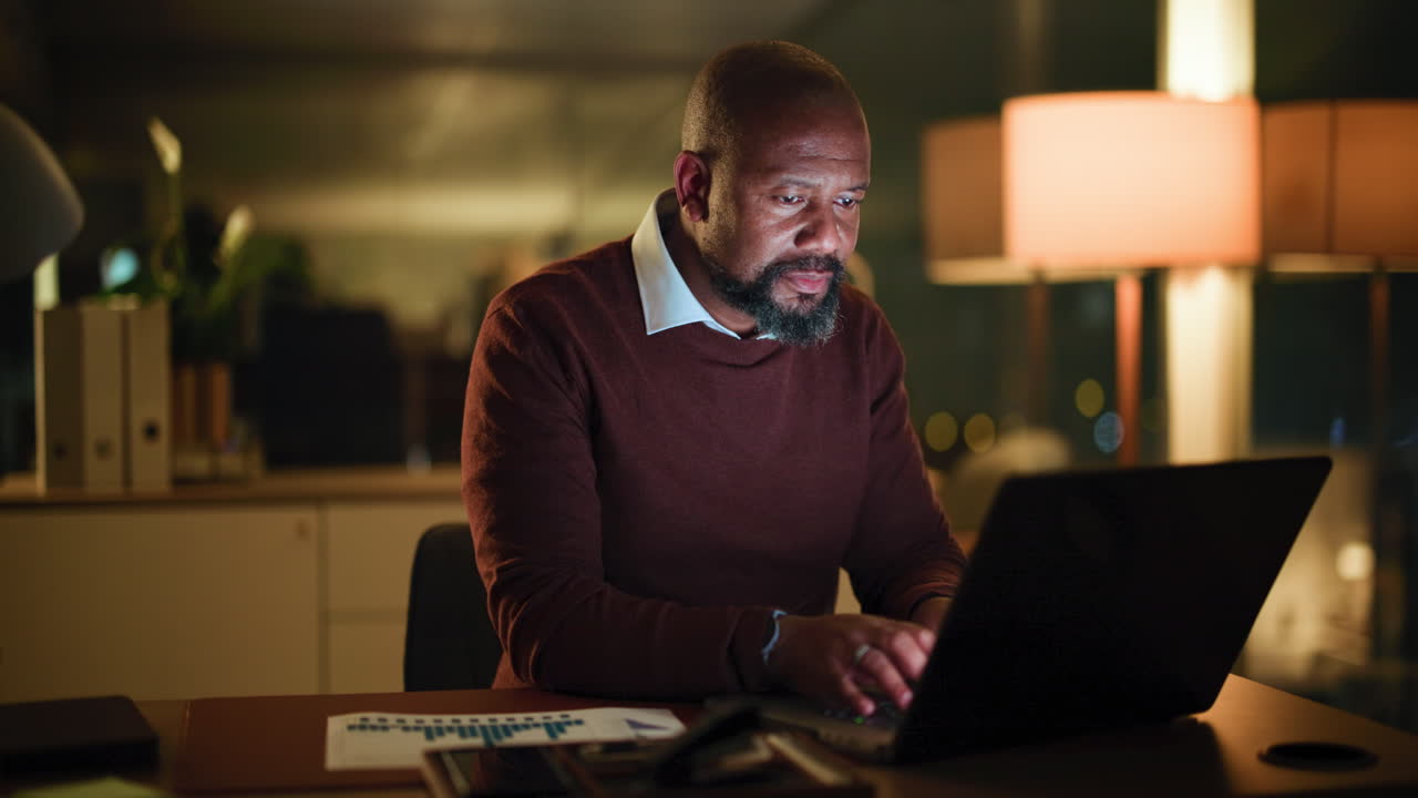 Man Working on Laptop in Office