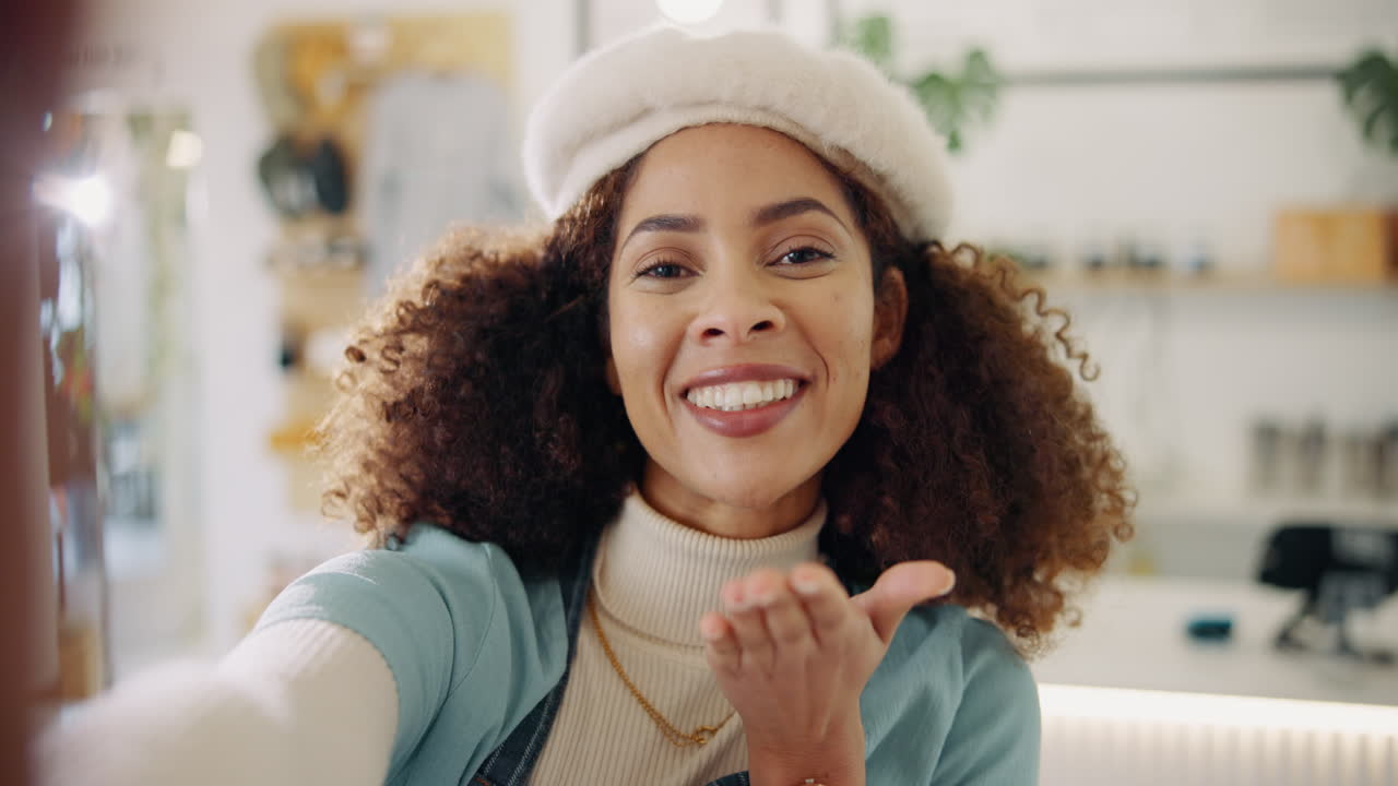 Woman blowing a kiss in a selfie