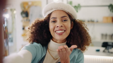 woman blowing a kiss in a selfie