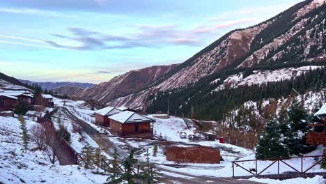 Traditional-large-classic-log-cabin-in-the-mountains-on-a-snowy-cold-winters-day