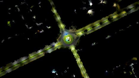 Night-Drone-shot-of-a-round-about,-Circle,-with-no-traffic-on-the-road,-India-street,-Gandhinagar,-Gujarat,-India