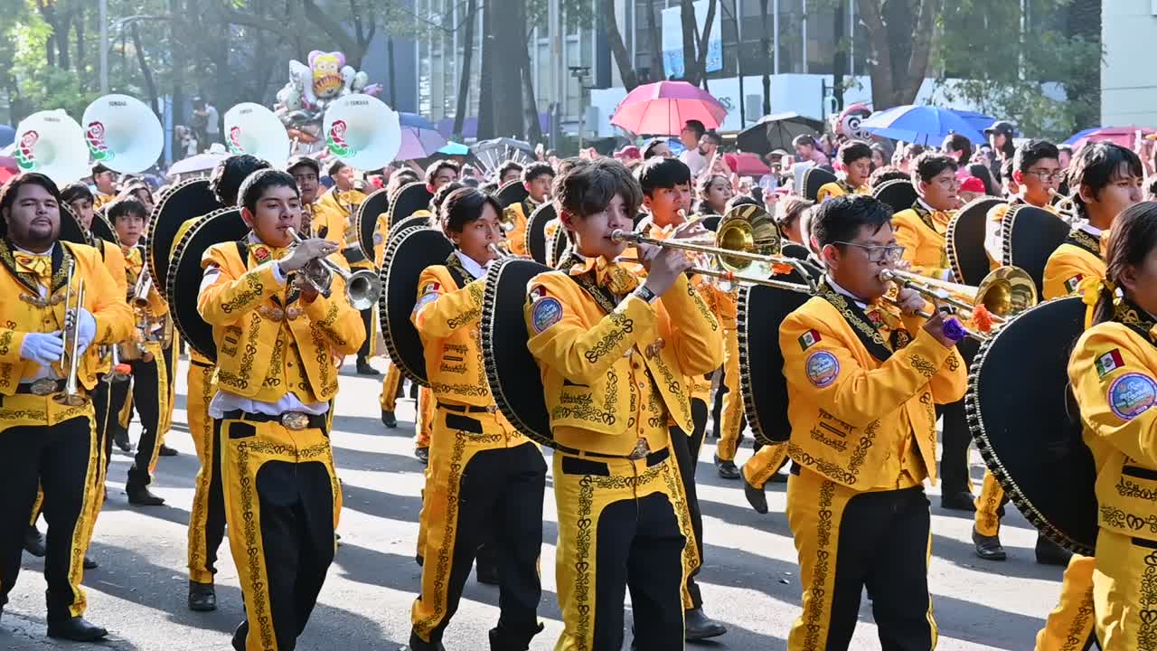 Band of artists playing traditional music at the Day of the Dead parade in Mexico City.