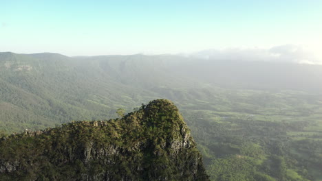 4K-drone-shot-with-orbit-motion-of-a-mountain-and-beautiful-landscape-at-Border-Ranges-National-Park,-New-South-Wales-in-Australia