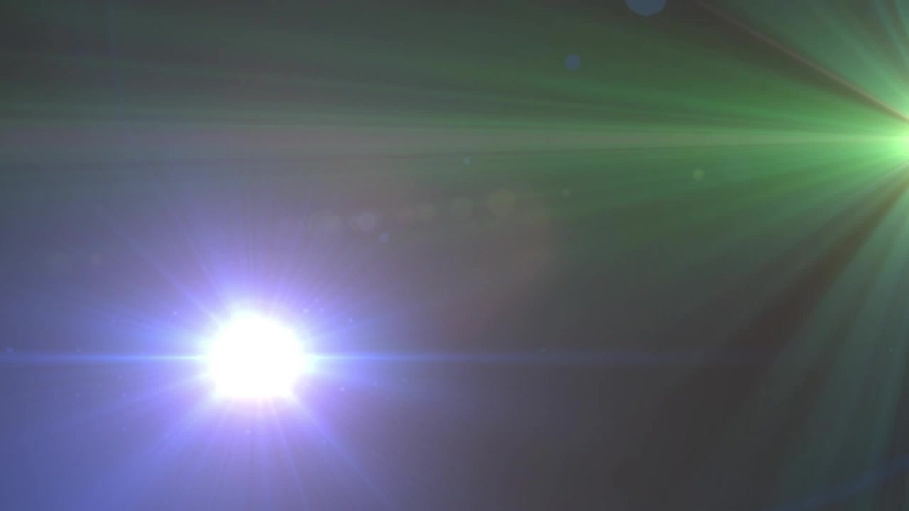 Abstract Green and Blue Lens Flare Light Effect on Dark Background