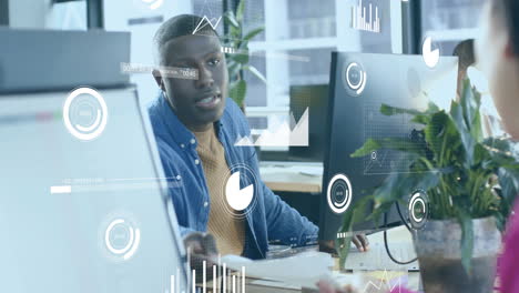 animation of financial data processing over african american businessman working in office