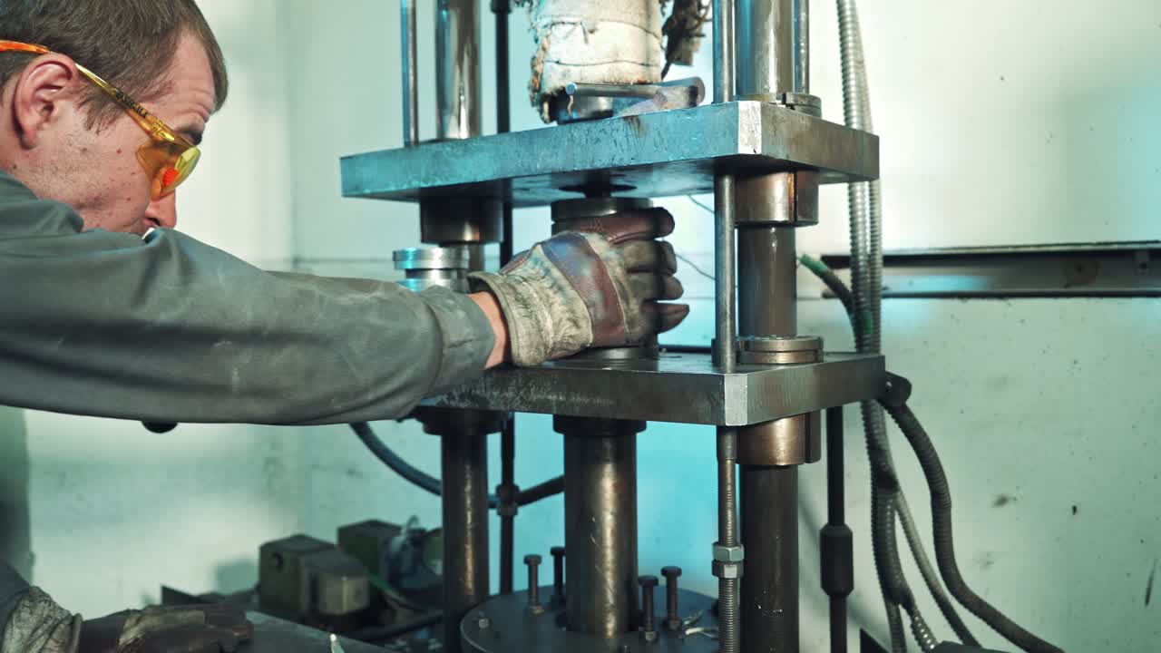 Metal working concept. Technician operator use hydraulic bending machine