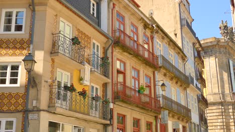 terraced balcony at the facade of historic architctures in the streets of porto, portugal