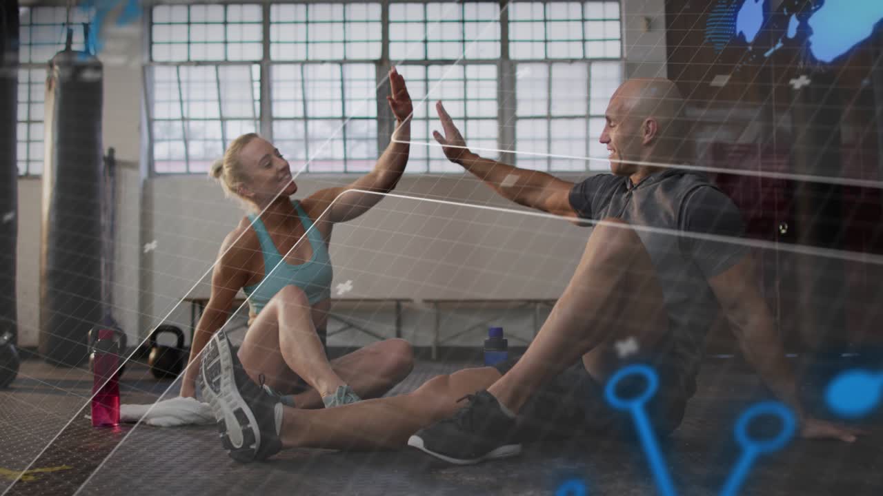 Training pair stretching, gesturing, high-fiving on gym floor while HUD sweeping, marking gains