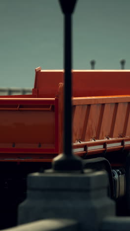 orange dump truck on city street