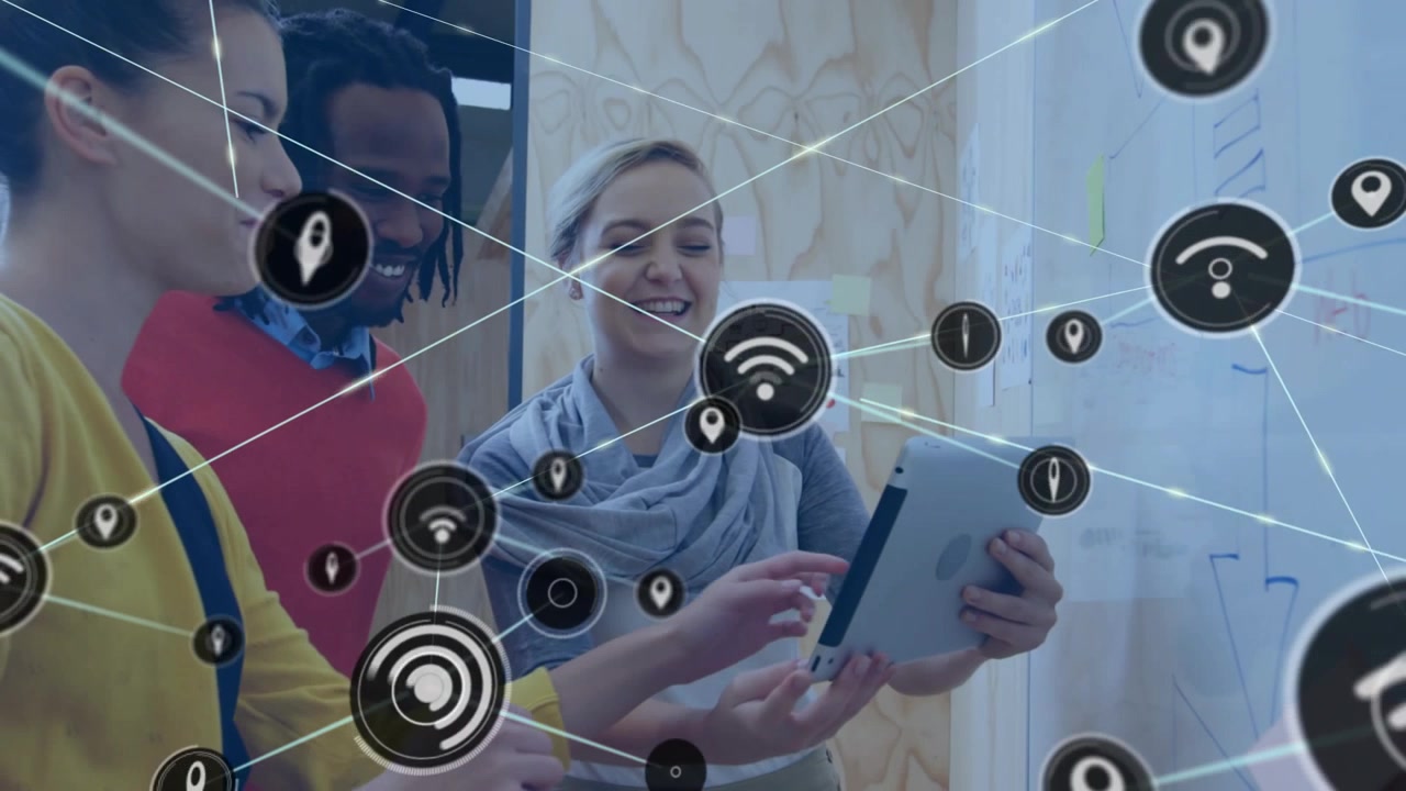 Team tapping tablet at board, creating expanding network icons covering frame for business