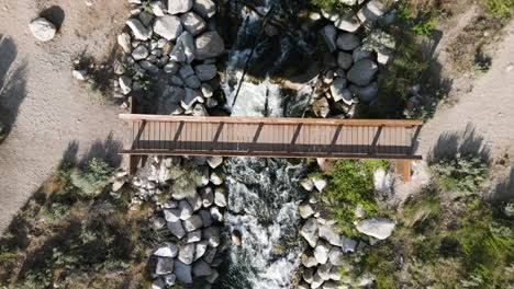 Top-View-Of-A-Small-Bridge-Over-Flowing-River-In-Bell-Canyon-Trail,-Sandy-Utah-USA