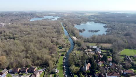 drone flies backwards high over the small village fordwich, england